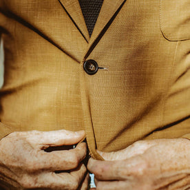 Close up shot of our fit model int the British Khaki suit