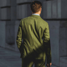 The back of our fit model wearing our green suit