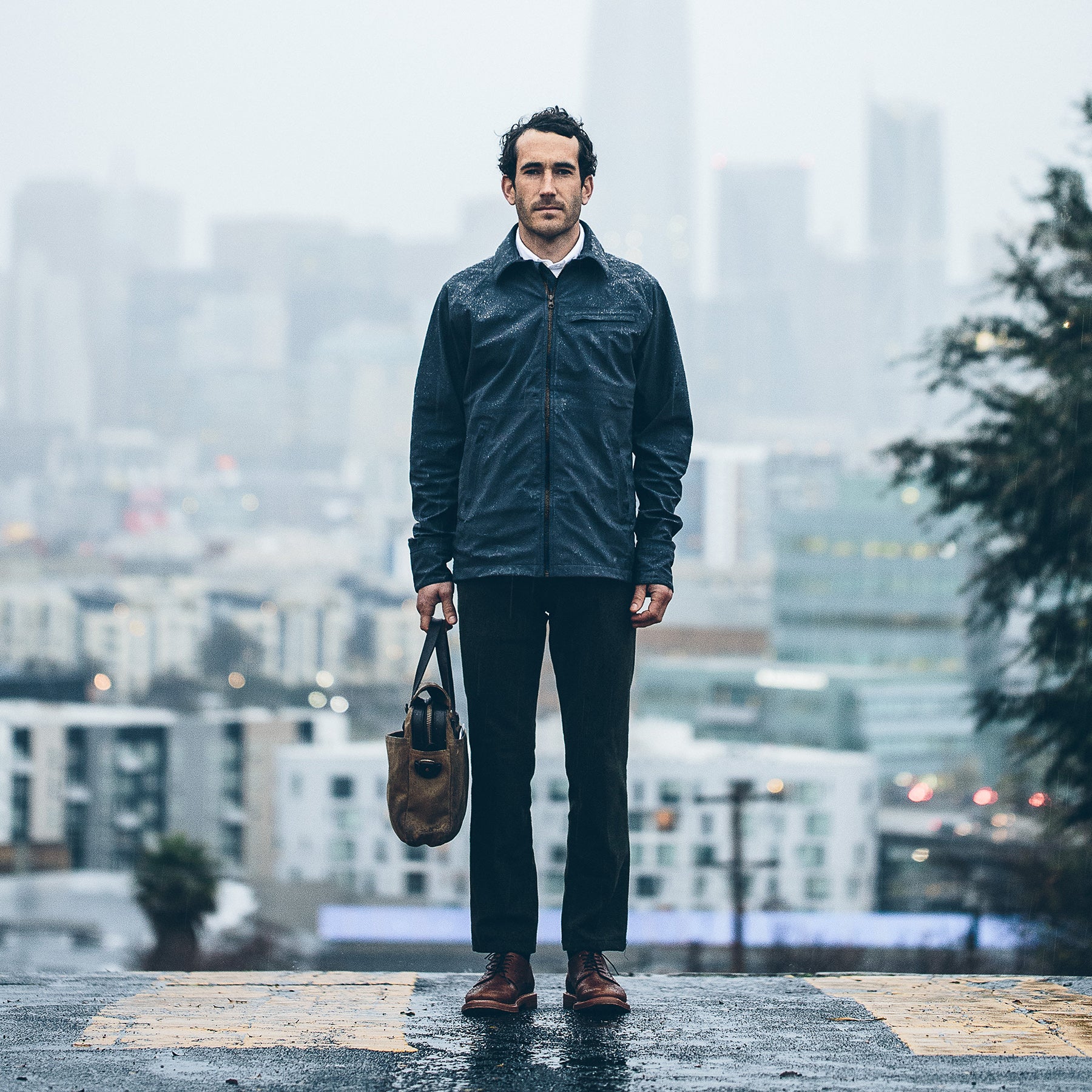 Mikey in the city wearing the rain proof jacket, Outerwear by Taylor Stitch