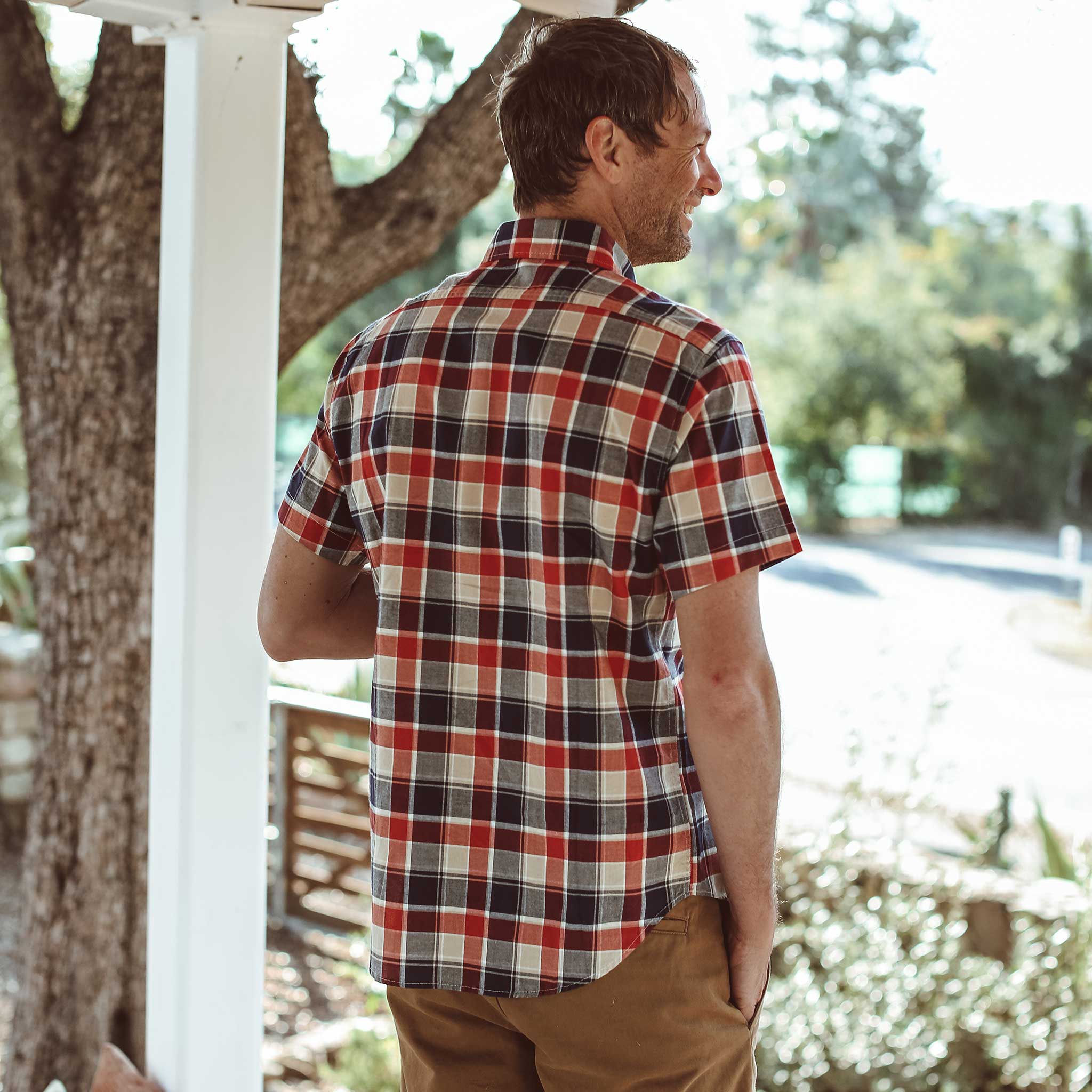Tim looking over his garden , Wovens by Taylor Stitch