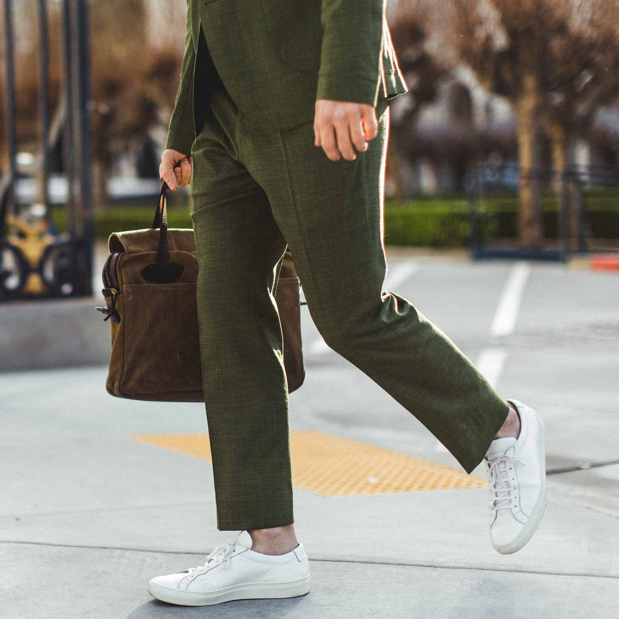 Joe walking through San Francisco in his white shoes, Pants by Taylor Stitch