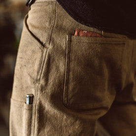 Our fit model wearing The Chore Pant in British Khaki Tuff Duck from Taylor Stitch.