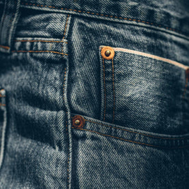 Detail shot of the 24 month wash denim worn by our fit model