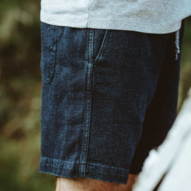 The detail shot of the fit model in out shorts