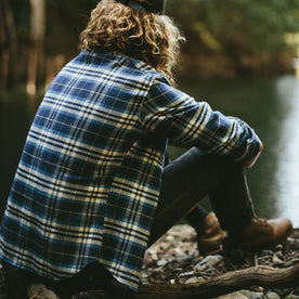 the fit model in The Crater Shirt in Blue Plaid next to the lake