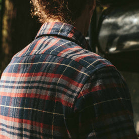 The fit model facing away in the Crater Shirt in Burgundy Plaid