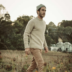 Our fit model walking to the dock in The Fisherman Sweater.