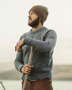 David out on the water in his Fisherman Sweater, Knits by Taylor Stitch