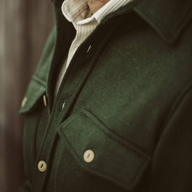 A close up of our fit model wearing the Maritime Shirt Jacket in Olive