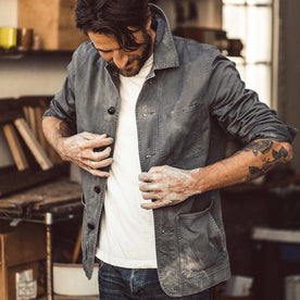 fit model putting on The Ojai Jacket in Washed Charcoal