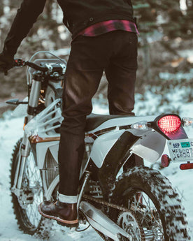 Allen with his motorcycle in the snow, Denim by Taylor Stitch