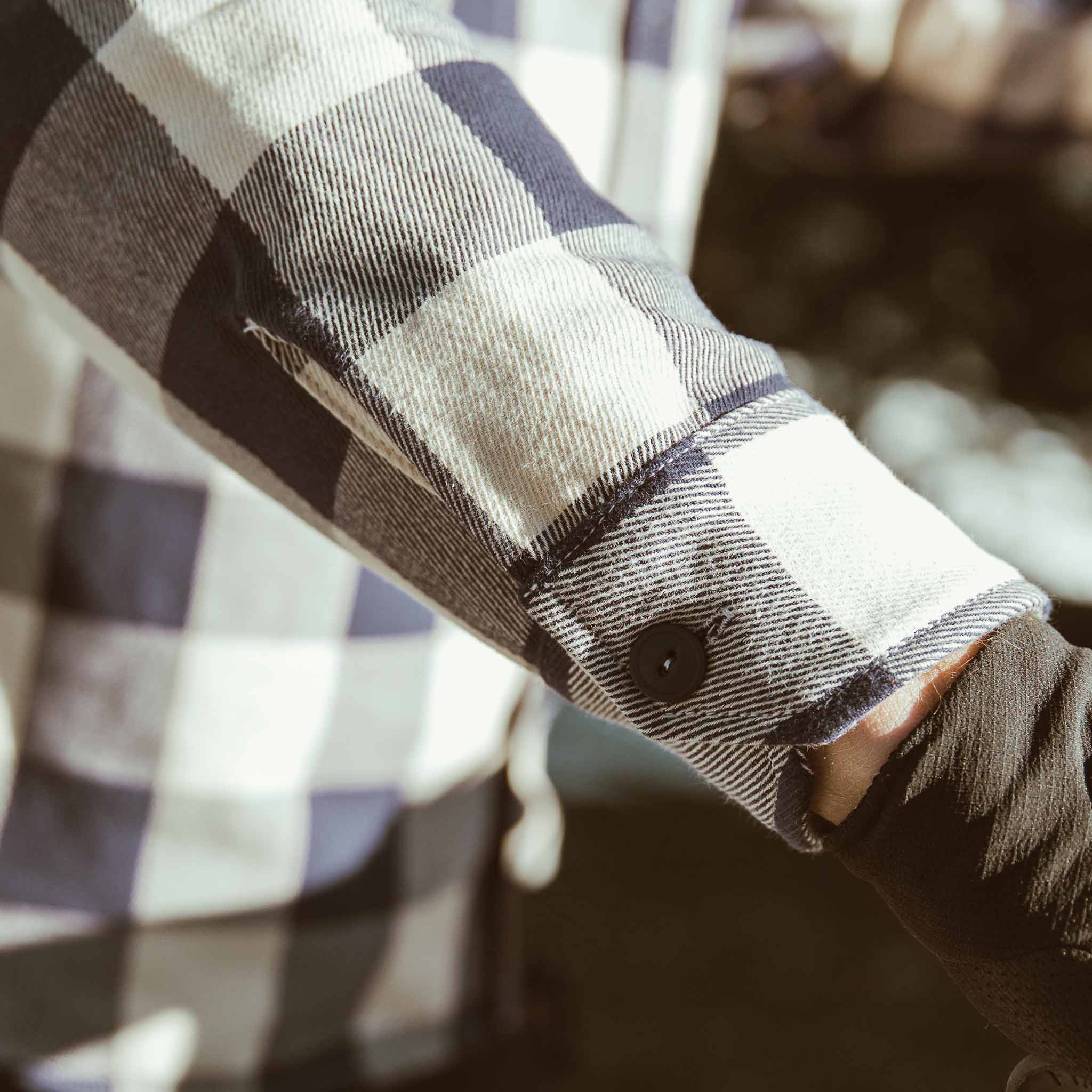 Logan about to ride a motorcycle , Wovens by Taylor Stitch