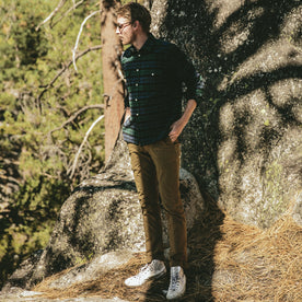 fit model next to a bouldering spot