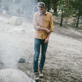 The fit model by the camp fire