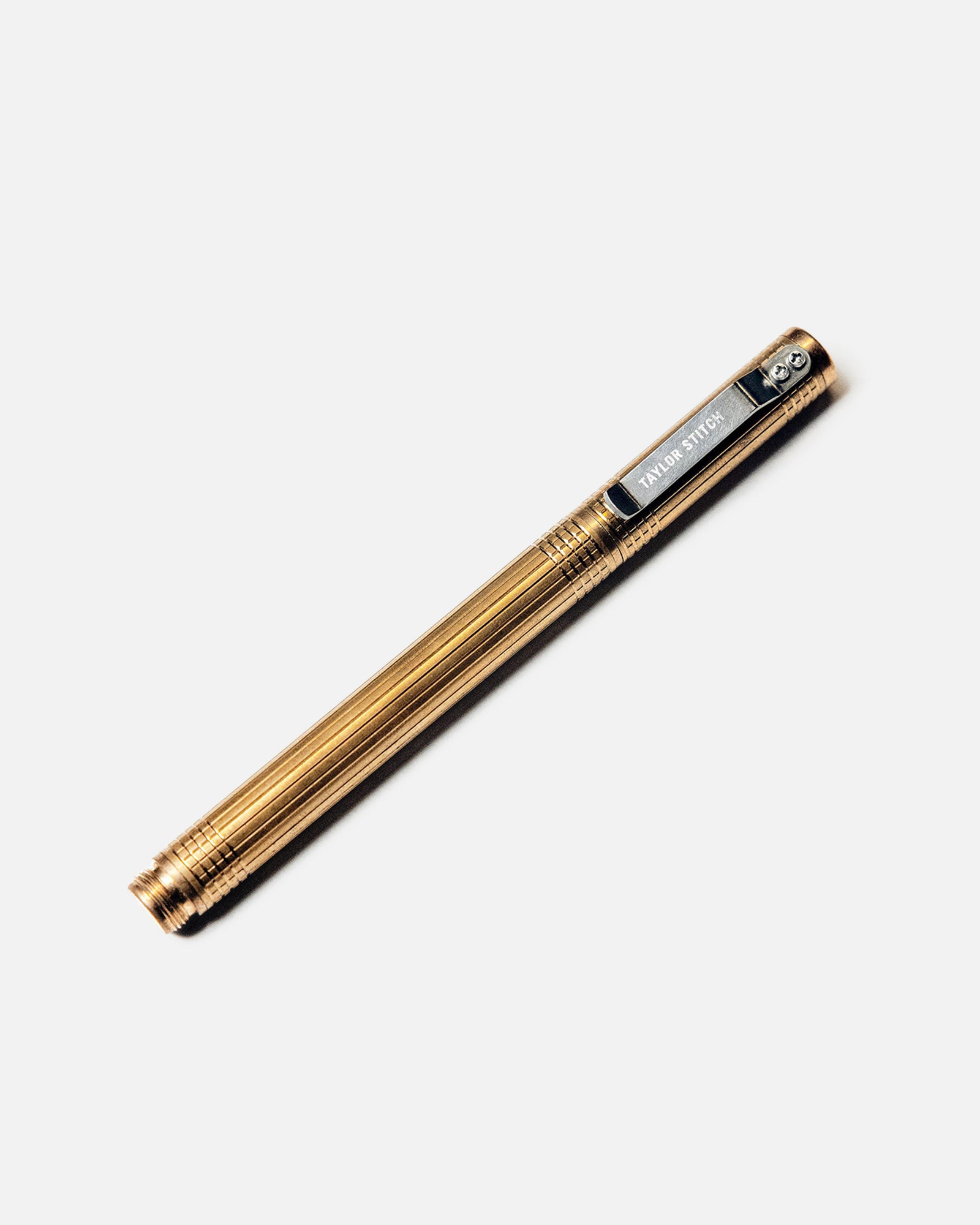 flatlay of The Pen in Brass, Accessories by Taylor Stitch