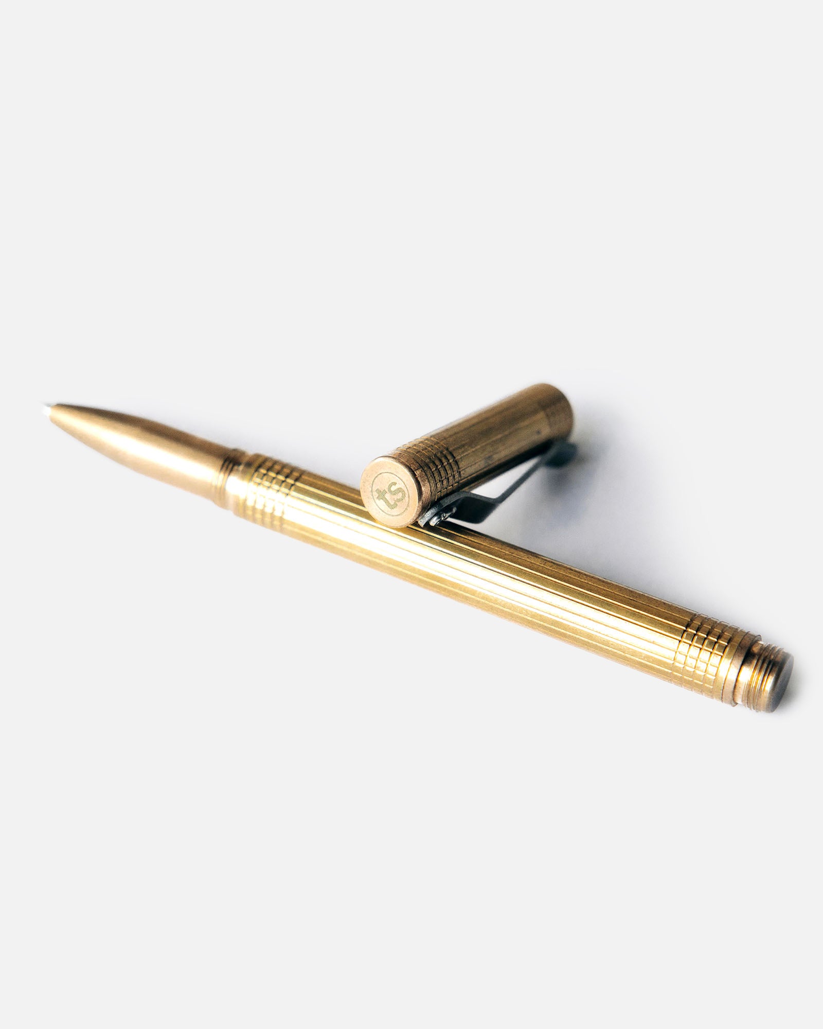 material shot of the cap and pen on The Pen in Brass, Accessories by Taylor Stitch