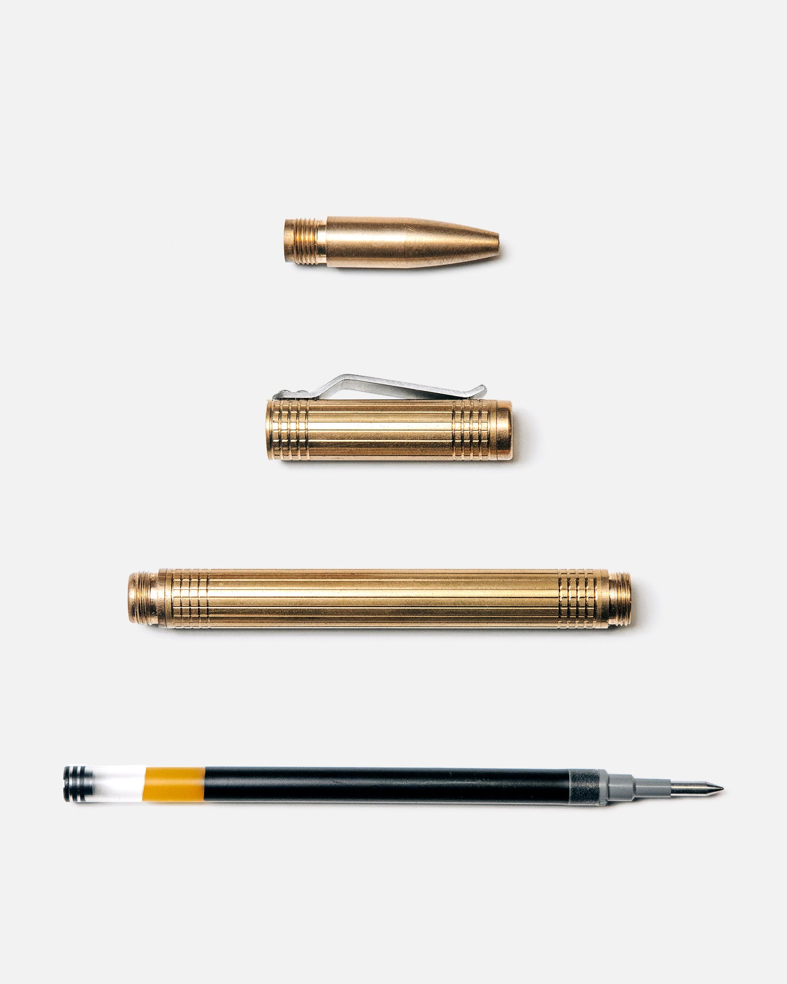 flatlay of The Pen in Brass shown open, Accessories by Taylor Stitch