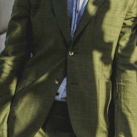 The front of our fit model in the evergreen suit