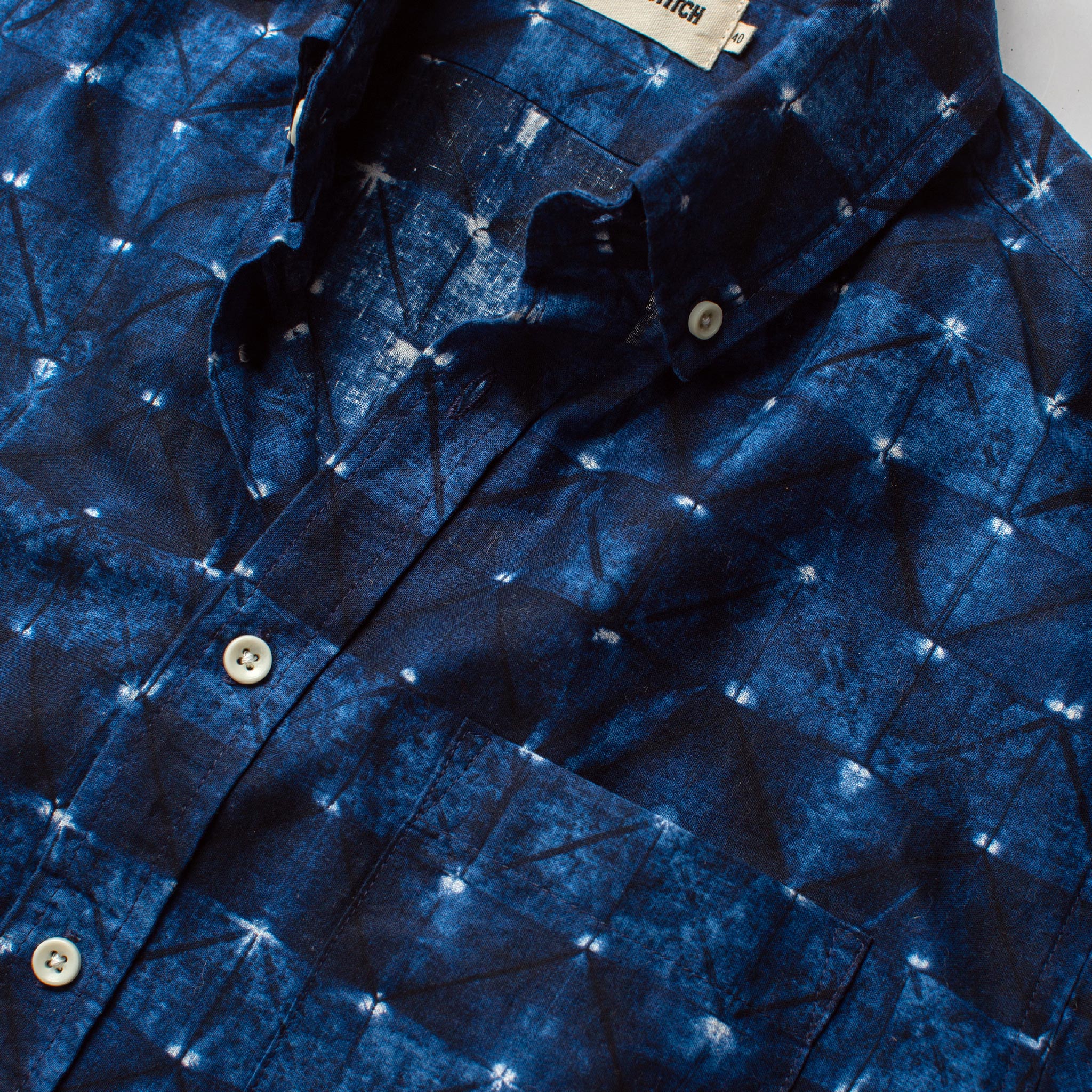 material shot of the collar and buttons on The Short Sleeve Jack in Deep Navy Geo, Wovens by Taylor Stitch