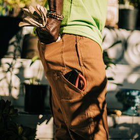 fit model using back pocket of The Carpenter Pant in Cedar Boss Duck