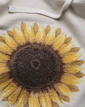 material shot close up of the embroidery of The Fillmore Hoodie in Sunflower Embroidery, Knits by Taylor Stitch