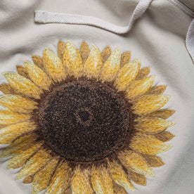 material shot close up of the embroidery of The Fillmore Hoodie in Sunflower Embroidery