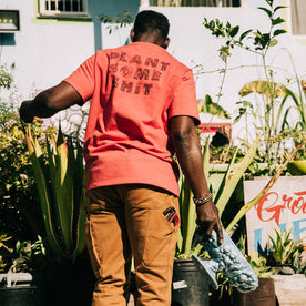 fit model showing printed back of The Heavy Bag Tee in Hibiscus