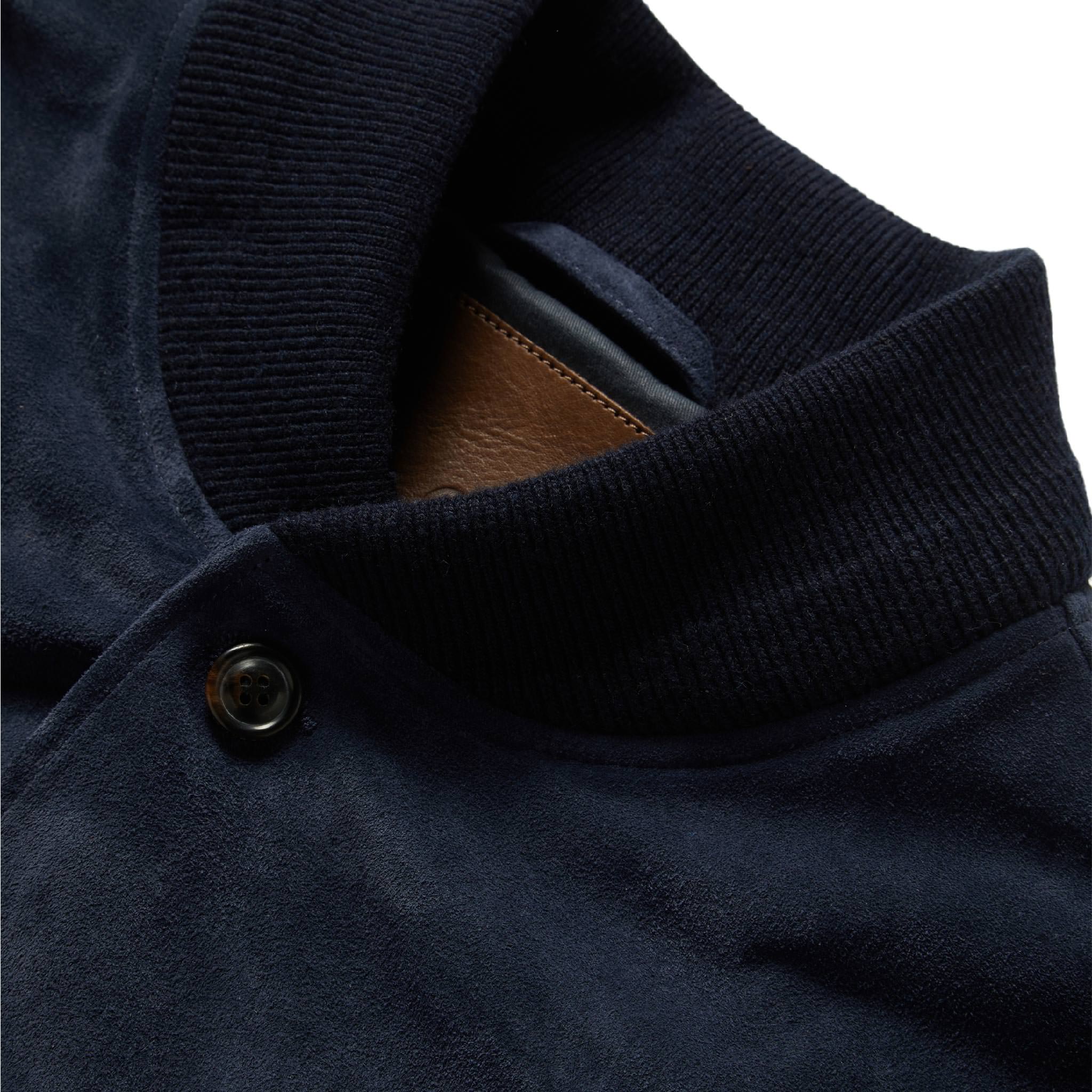 material shot of The Aviator Jacket in Midnight Suede showing interior label, Outerwear by Taylor Stitch