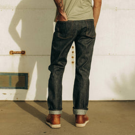 fit model wearing The Democratic Jean in Natural Indigo Selvage, shown from the back