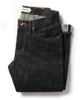 flatlay of The Slim Jean in Natural Indigo Selvage, Bottoms by Taylor Stitch