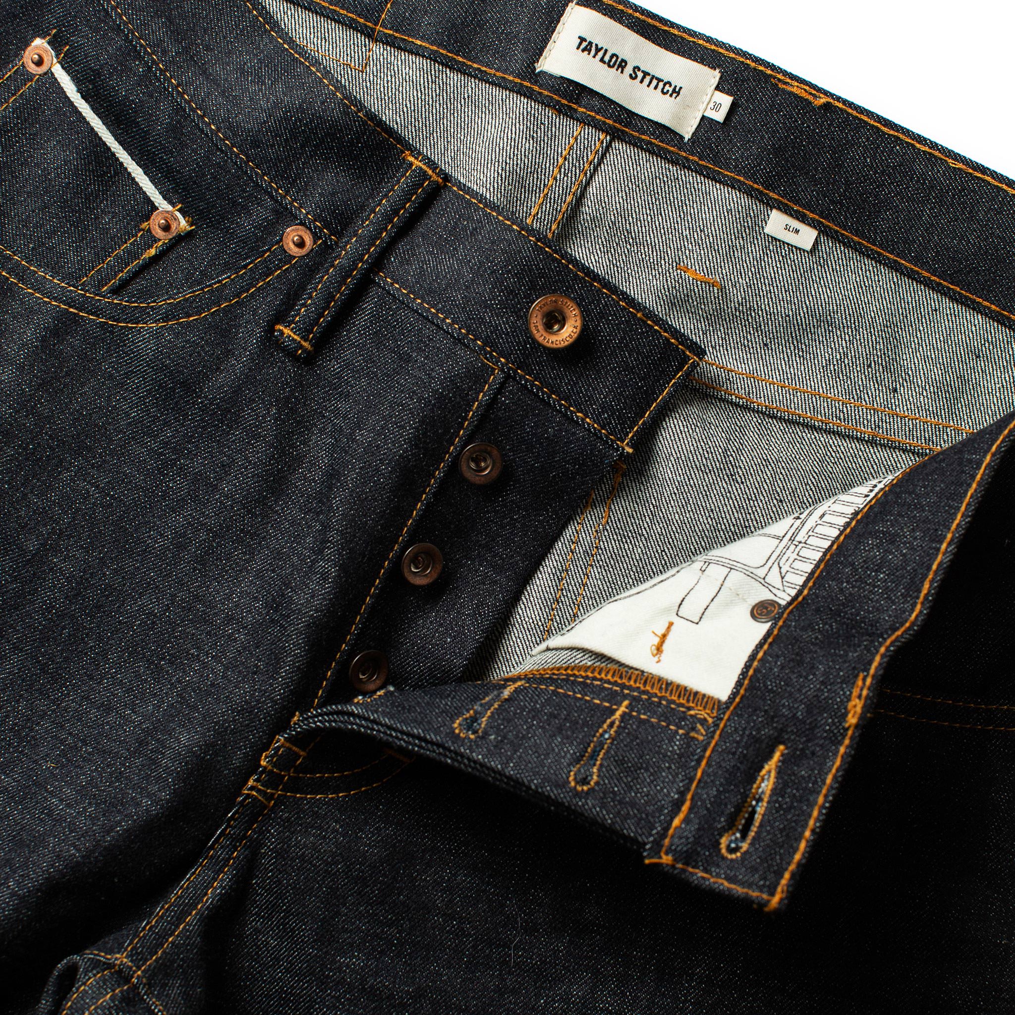 material shot of the waist on The Slim Jean in Natural Indigo Selvage, Bottoms by Taylor Stitch