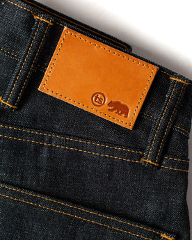 material shot of the leather patch on The Slim Jean in Natural Indigo Selvage, Bottoms by Taylor Stitch