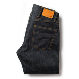 flatlay of The Slim Jean in Natural Indigo Selvage, shown folded from the back