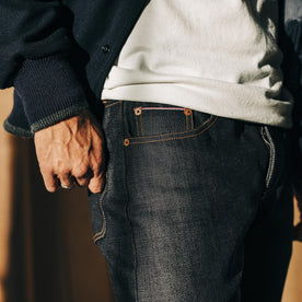 fit model showing off pockets on The Slim Jean in Kuroki Welterweight Slub