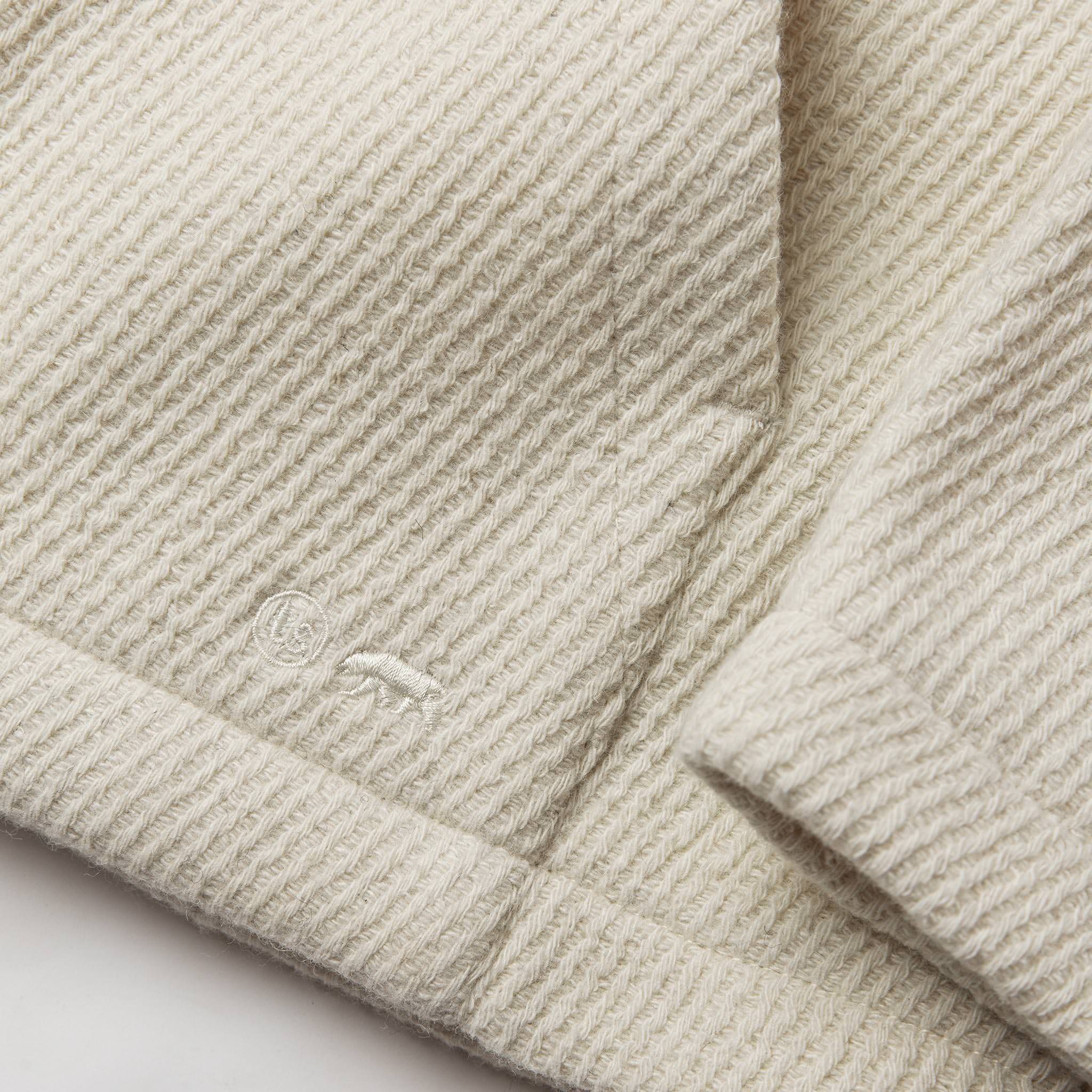 fabric shot of texture and logo, Knits by Taylor Stitch