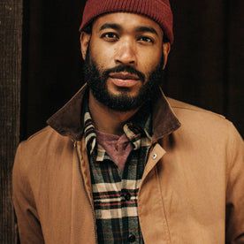 fit model wearing The Workhorse Jacket in Tobacco Boss Duck, looking into camera
