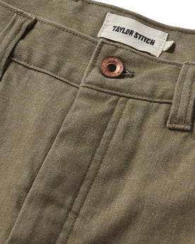 material shot of the button closure on The Shaper Short in Stone Boss Duck, Bottoms by Taylor Stitch