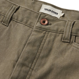 material shot of the button closure on The Shaper Short in Stone Boss Duck