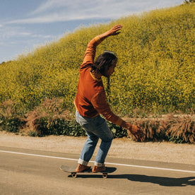 fit model skateboarding in The Fillmore Crew in Campfire Colorblock
