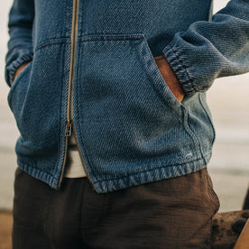 fit model with his hands in the pockets of The Riptide Jacket in Washed Indigo Twill