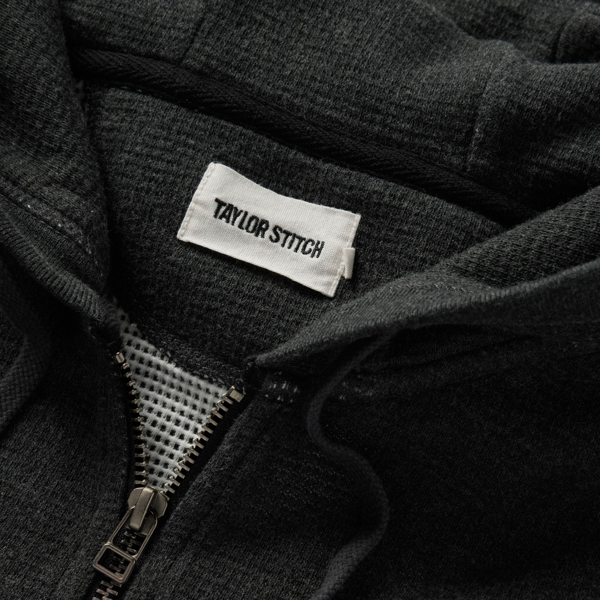 material shot of the zipper on The Weekend Hoodie in Coal Double Knit, Knits by Taylor Stitch