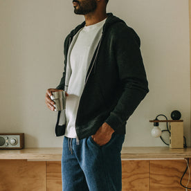 fit model standing in The Weekend Hoodie in Coal Double Knit