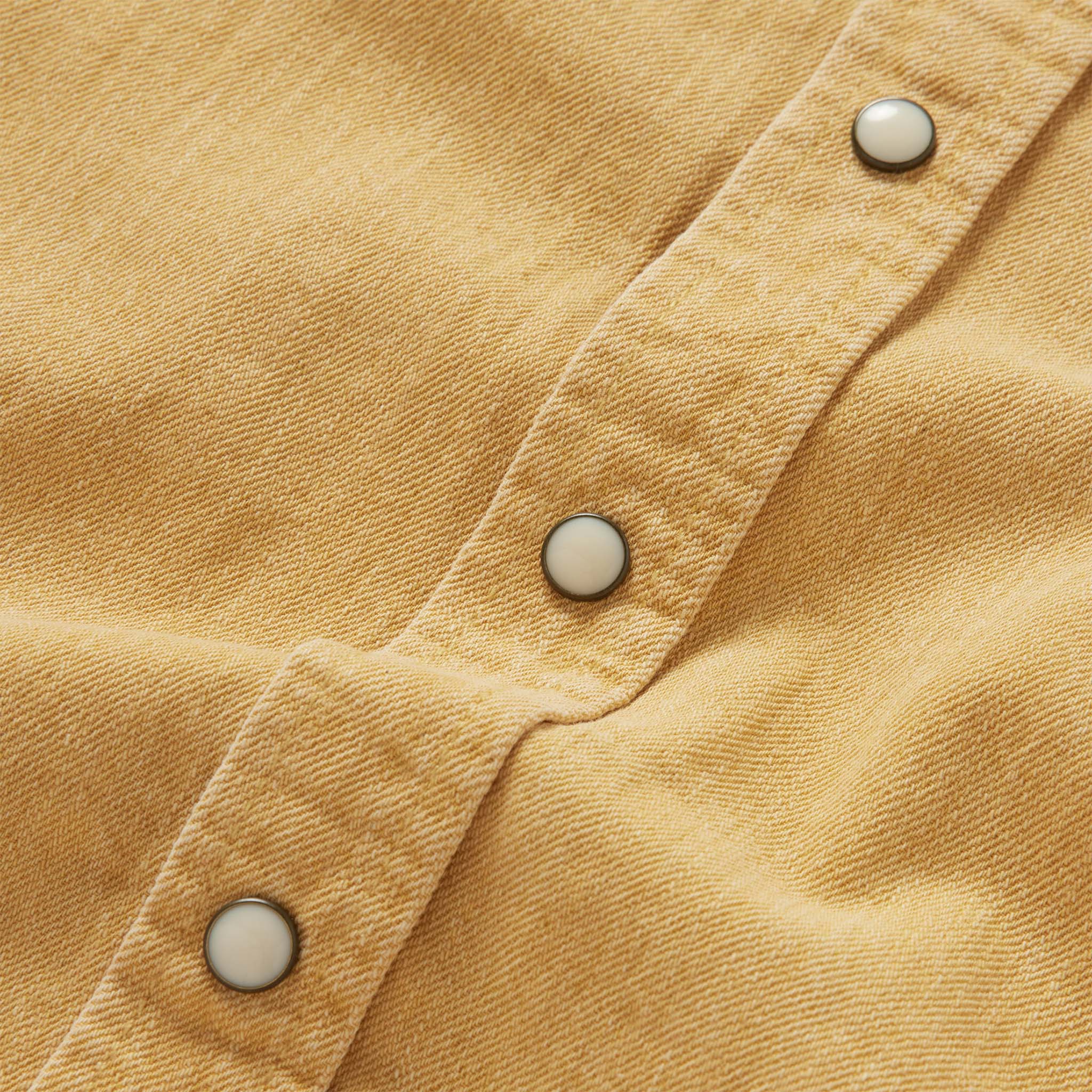 material shot of the buttons on The Western Shirt in Wheat Selvage Denim, Wovens by Taylor Stitch