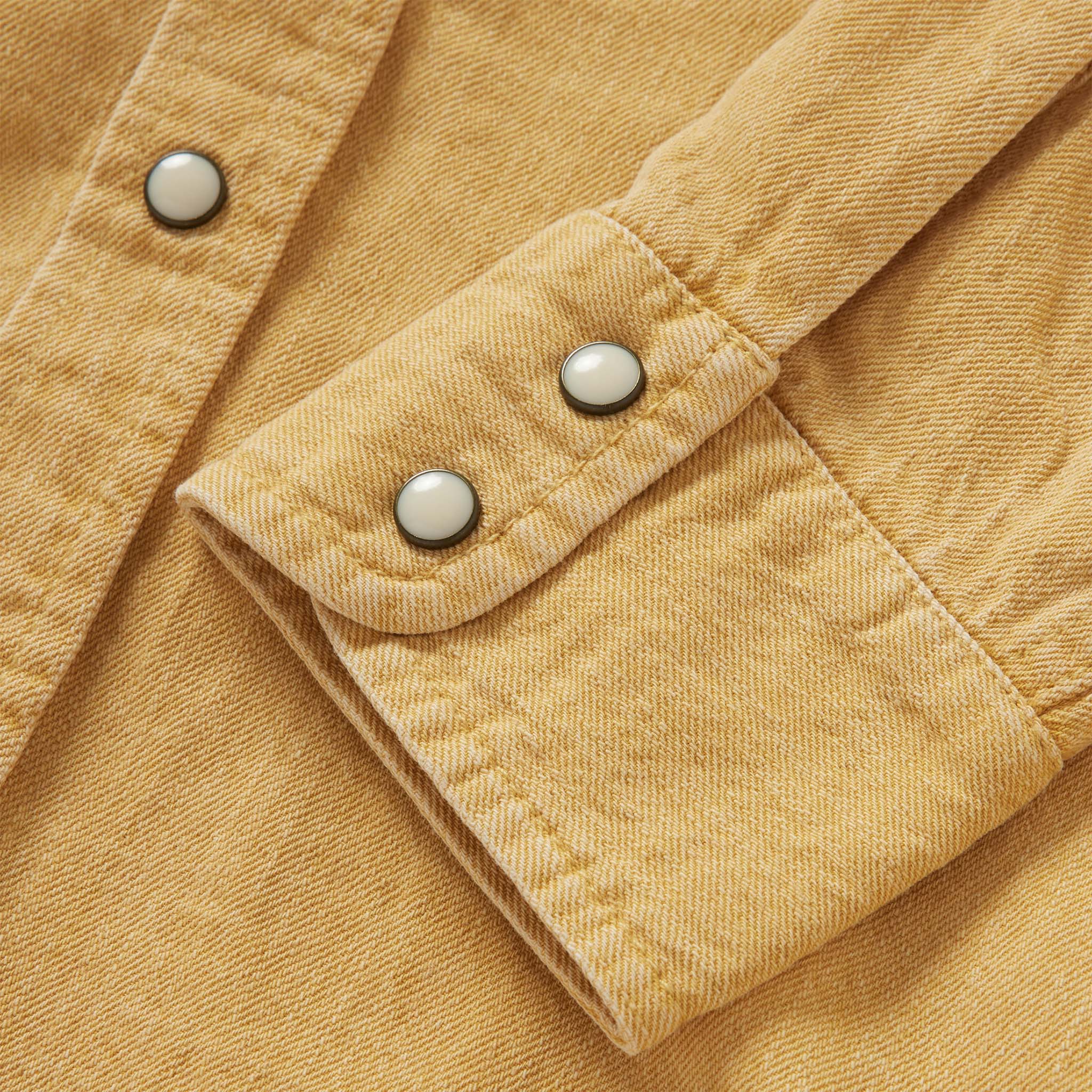 material shot of the cuff of The Western Shirt in Wheat Selvage Denim, Wovens by Taylor Stitch
