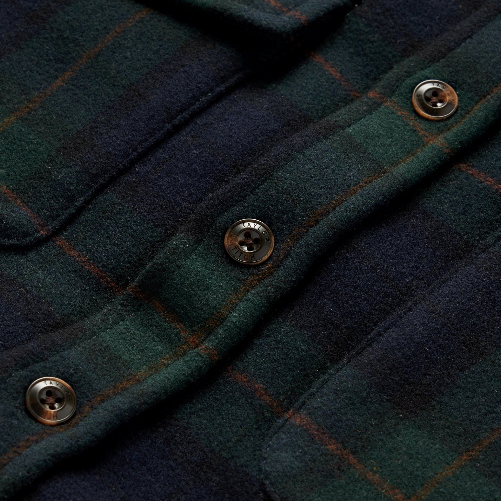 material shot of the buttons on The Maritime Shirt in Saltwater Plaid, Wovens by Taylor Stitch
