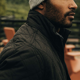 fit model showing the texture on The Vertical Jacket in Black