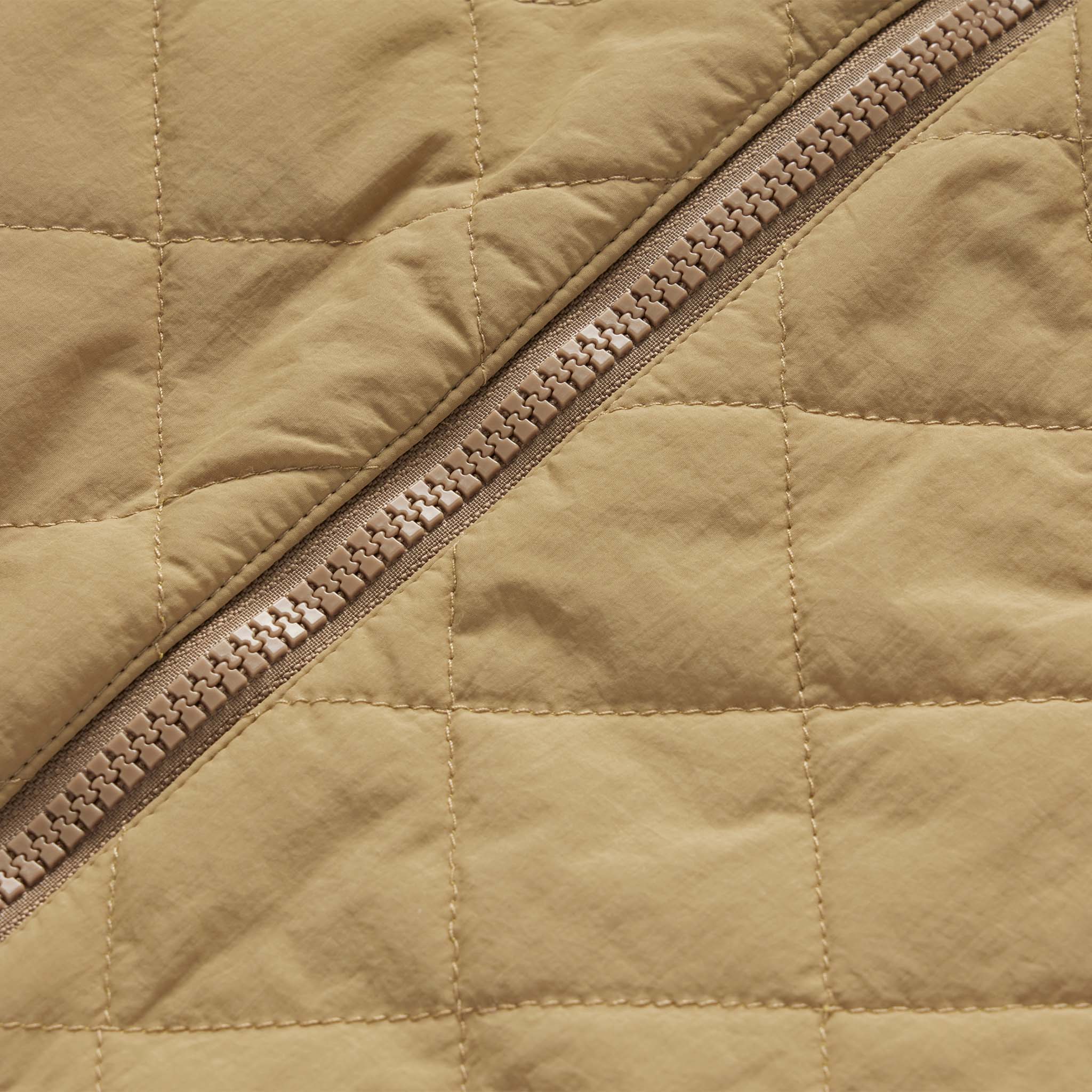material shot of the YKK zipper on The Vertical Jacket in Khaki, Outerwear by Taylor Stitch