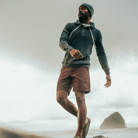 fit model walking on the beach in The Morse Short in Russet Linen