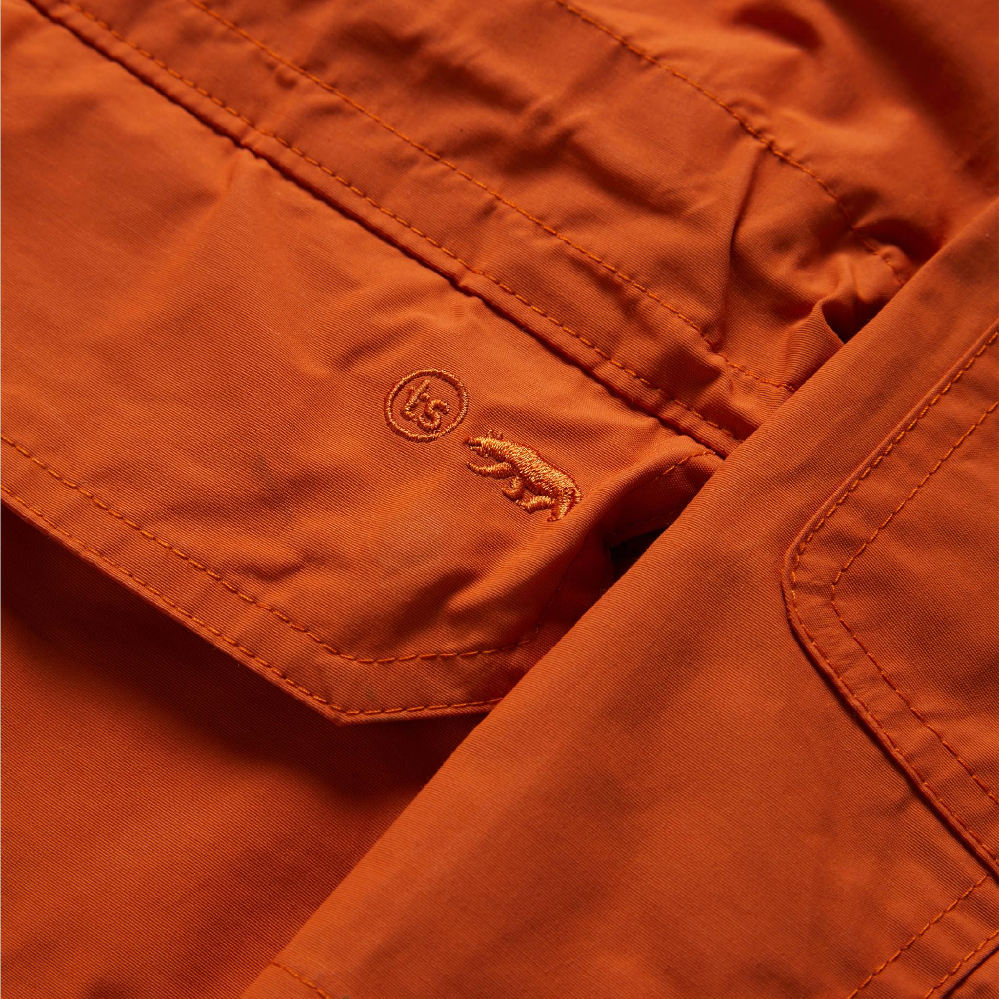 material shot of embroidered front pocket of The Dalton Jacket in Rust, Outerwear by Taylor Stitch
