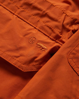 material shot of embroidered front pocket of The Dalton Jacket in Rust, Outerwear by Taylor Stitch